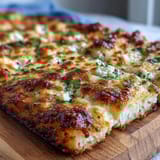 Two Fluffy Cottage Cheese Flatbreads stacked on a wooden board, soft and pliable for wrapping veggies or dipping.