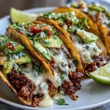 Interactive taco bar featuring seasoned ground beef, black beans, and an array of toppings perfect for Cinco de Mayo celebrations.  