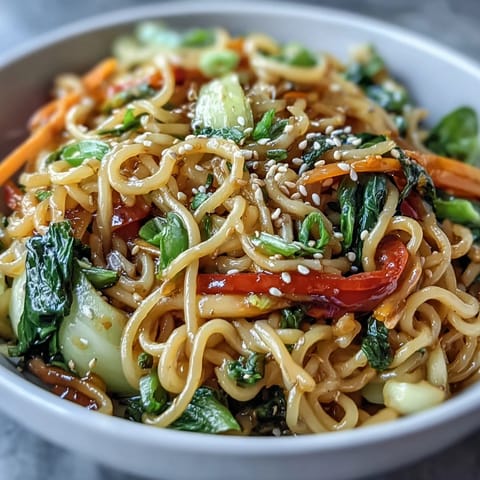 Freshly prepared Shirataki Noodle Bowl garnished with toasted sesame seeds and cilantro, served steaming hot in a ceramic bowl.